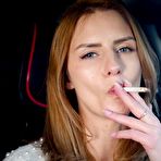 Second pic of Russian Smokers | Meet Anastasia in her car while she is smoking two 120mm all white cigarettes