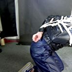 Fourth pic of Shinynylonartsbound | Watching sexy Sonja being tied and gagged overhead with ropes and a clothgag from a female rigger both wearing sexy shiny nylon rainwear (Video)