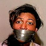 Fourth pic of tied-and-gagged.com | 27 Yr OLD BEAUTY SALON OWNER IS WRAP TAPE GAGGED, BAREFOOT, TOE-TIED, MOUTH STUFFED WITH THONGS, HANDGAGGED & TIGHTLY TIED ON THE BED (D75-11)