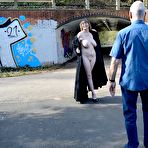 Fourth pic of Amateur Milf in a long trench coat flashes her huge tits and shaved twat in Weddington Walk – Bare Milfs