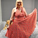 First pic of English Milf wearing a Red Polka Dot Dress takes her knickers half way down and shows off her bald wet cunt – Bare Milfs