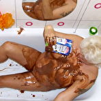 Third pic of Mature woman covers her body with chocolate pudding - Mature.nl