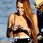 First pic of Lindsay Lohan shows cleavage in black bikini in Malibu