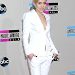 Second pic of Miley Cyrus no bra under white jacket at AMA 2013