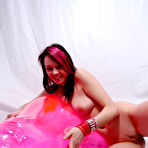 Third pic of Zophia with a pink inflatable dolphin
