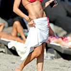 Third pic of LeAnn Rimes shows side of boob in red bikini in Malibu