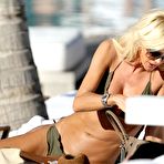 Fourth pic of Victoria Silvstedt in green bikini on the beach in Caribbean