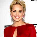 Third pic of Sharon Stone pokies under tight red dress