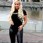 Fourth pic of Nicole Austin AKA Coco in tight black clothing posing at Energy Bullrun Rally