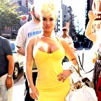 Fourth pic of Busty Nicole Austin shows deep cleavage in short yellow dress