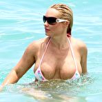 Second pic of Busty Nicole Austin shows areola slip in thong bikini
