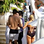 First pic of Paris Hilton wearing a swimsuit at a pool in Miami