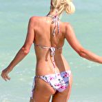 Fourth pic of Paris Hilton wearing a swimsuit at a pool in Miami