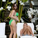 Third pic of Kelly Brook in green bikini poolside shots