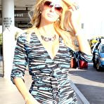 Third pic of Paris Hilton legs and cleavage paparazzi shots
