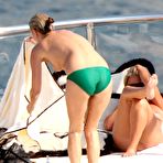 First pic of Kate Moss sunbathing topless on the yacht and beach