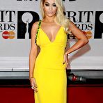 Second pic of Rita Ora slight cleavage in yellow dress