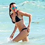 First pic of Katie Cassidy in dark bikini on the beach
