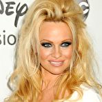 Fourth pic of Pamela Anderson posing in white dress paparazzi shots
