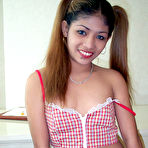 Third pic of Young pig-tailed Asian schoolgirl spreads her legs for you