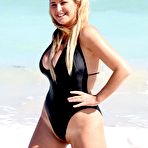 Second pic of Josie Goldberg boob out from black swimsuit on the beach