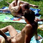 Second pic of Nude Beach. Two couples flirt while nude