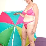 First pic of Chubby Loving - Mature Plumper Teasing Near Umbrella