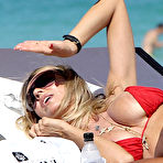 Second pic of Rita Rusic boobsliup in red bikini on the beach