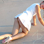 Second pic of Petite angel Josie graffitiing the basketball court without panties under tennis skirts
