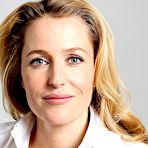 Second pic of Gillian Anderson in white blouse & black trousers