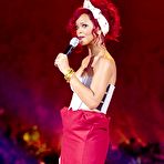 Fourth pic of Rihanna sexy in short red skirt at Christmas lights in London