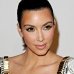 First pic of Kim Kardashian posing for paparazzi in short white dress