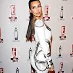 Second pic of Kim Kardashian posing for paparazzi in short white dress