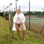 Third pic of SexPreviews - Natasha Smith blonde MILF showing her pussy in tan pantyhose near tenniscourt