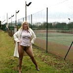 Fourth pic of SexPreviews - Natasha Smith blonde MILF showing her pussy in tan pantyhose near tenniscourt