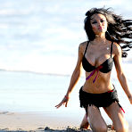 Fourth pic of Tila Tequila deep cleavage in black bikini on the beach