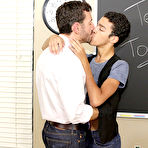 Third pic of He bends his student over a stool and his desk, making the thin twink moan as he fucks him cum gay twink at Teach Twinks