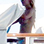 First pic of Paris Hilton caught topless on the boat with her sister