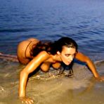 Second pic of Melita Toniolo topless on the beach backstage calendar shots