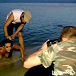 Third pic of Melita Toniolo topless on the beach backstage calendar shots