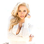 First pic of Dani Mathers rolling around in the sand on a beautiful beach