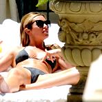 Fourth pic of Abigail Clancy cameltoe and cleavage poolside