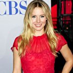 First pic of Kristen Bell in red dress posing at 38th Peoples Choice Awards