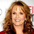 Second pic of Lea Thompson in red posing at premiere