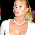 Third pic of Nicollette Sheridan shows deep cleavage when leaving restaurant