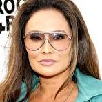 Fourth pic of Tia Carrere shows cleavage at premiere