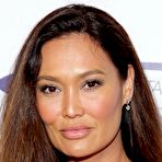 Second pic of Tia Carrere slight cleavage and legs paparazzi shots