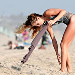 Fourth pic of AnnaLynne McCord wearing a swimsuit on a beach