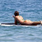 First pic of Abigail Clancy paddleboarding in green bikini