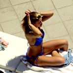 Third pic of Amy Willerton sunbathing in blue bikini
